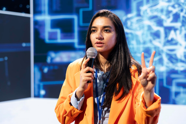 Student speaking at a technology summit